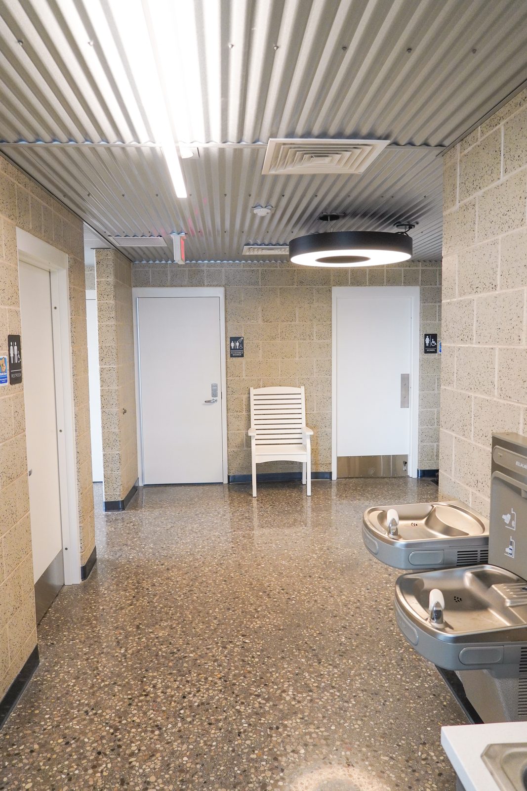Private shower room with a fold-down bench in the boaters' bathhouse.