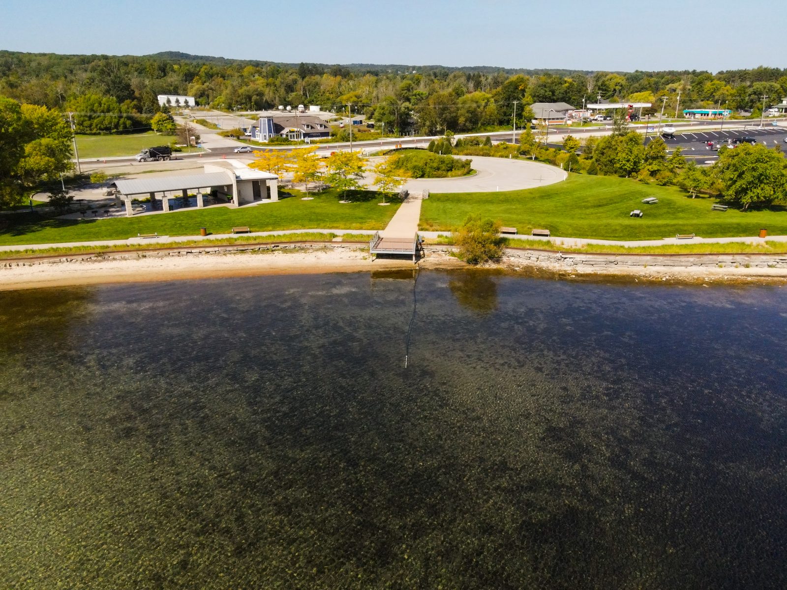 Aerial of the waterfront park, beach, and boardwalk along Grand Traverse Bay.