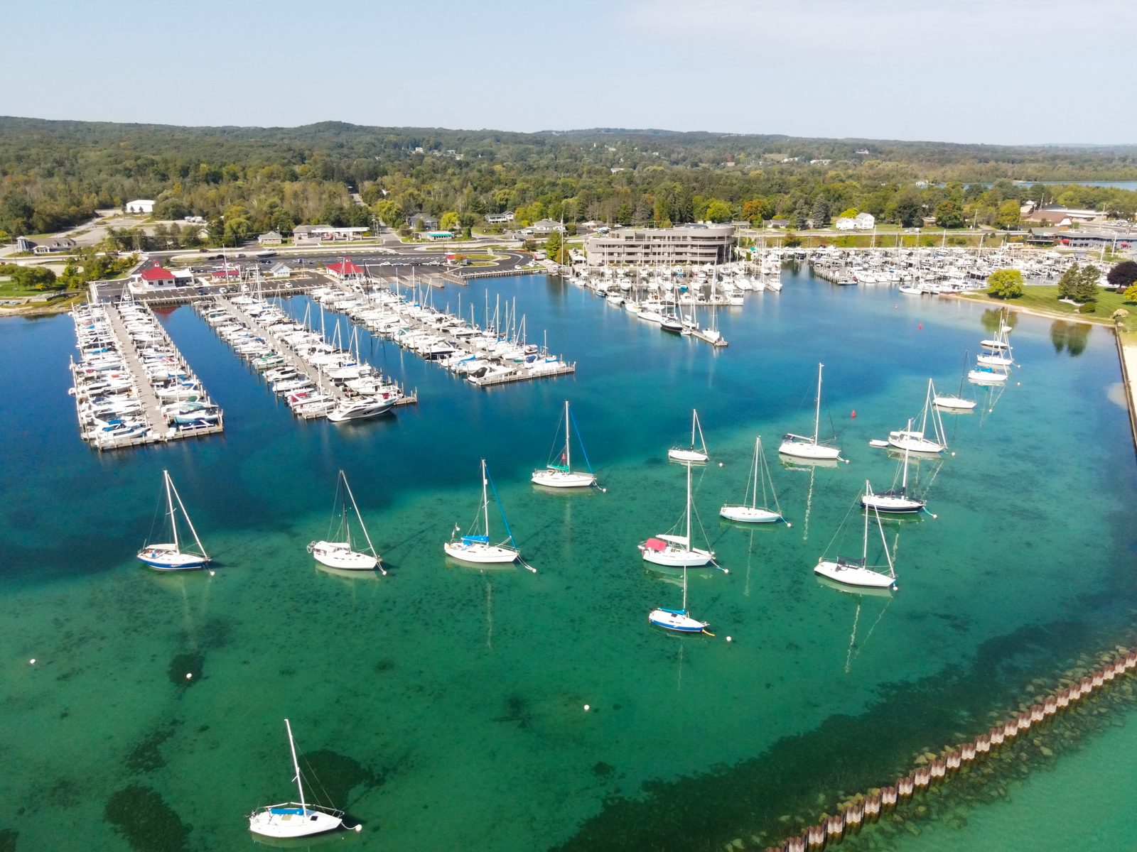 Aerial of the mooring field and marina basin on a bright summer day.